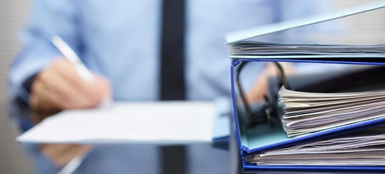 Man making notes on piece of paper